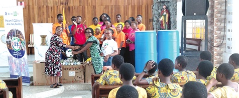 Dr Felicia Akuribrie (2nd from right) donating sporting items to a representative of the Korle Klottey Municipal Assembly Education Directorate who received it on behalf of Felicity Sarah Armah, Headmistress of St. Peters Catholic School