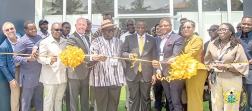 Emmanuel Armah-Kofi Buah (4th from right), Minister of Lands and Natural Resources, cutting the tape to officially open WAMPEX 2026. With him is Kenneth Ashigbey (5th from left), CEO, Ghana Chamber of Mines, and some officials