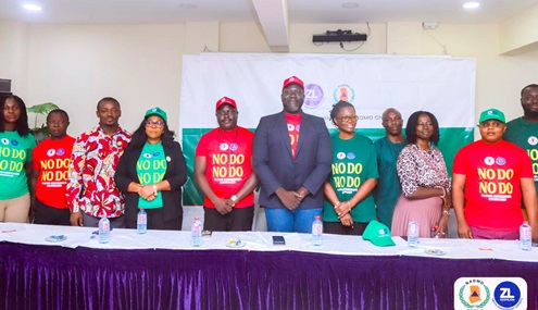 Dennis Adjannor Nartey (5th from right), Greater Accra Regional Director of NADMO; Emma Adwoa Appiah Osei-Duah (4th from right), General Manager, Zoomlion, and other officials after the launch 