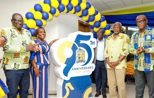 Nana Oye Bampoe Addo (2nd from left), Deputy Chief of Staff, Finance and Administration, Office of the President, being assisted by Edward Doe Adjaho (3rd from right), Chairman, Council of State; Eric Ebo Sey (left), Headmaster of Accra Academy to unveil the 95th anniversary logo. Picture: ELVIS NII NOI DOWUONA 