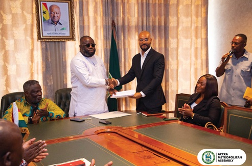 Michael Kpakpo Allotey (left), Accra Metropolitan Chief Executive, and Kelvin Boateng, Chief Executive Officer of Numatter Recycling Technologies Ltd, exchanging the MoU