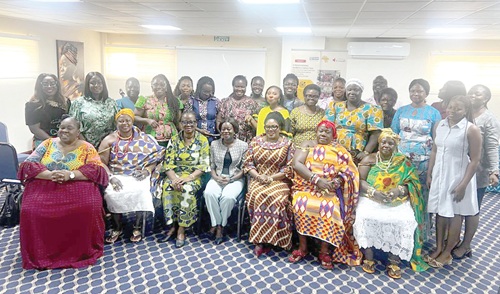Dr Agnes Naa Momo Lartey (seated 3rd from right), Minister for Gender, Children and Social Protection, with Dr Rose Mensah-Kutin (seated 3rd from left), Executive Director, Abantu for Development, with participants after the launch