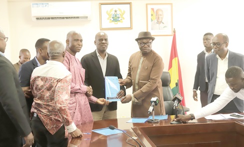 Haruna Iddrisu (3rd from right), Minister of Education, exchanging the signed documents with Dr Christian Addai-Poku (2nd from right), Registrar, NTC, and Prof. Seidu Al-hassan (3rd from left), Vice-Chancellor, UDS. With them are Prof. Ernest Kofi Davis (right), Director-General of GES, and some heads of participating schools. Picture: EDNA SALVO KOTEY