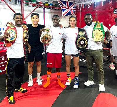 • Boxing Is Love CEO Spencer Lee Boya (second left) poses with former champion Theophilus Kpakpo Allotey (left), Justin Sammah and others in the newly refurbished ring at Wisdom Gym