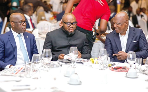 Ato Afful (right), Managing Director, Graphic Communications Group Ltd, interacting with Mohammed Adams Sukparu (middle), Deputy Minister of Communications, Digital Technology and Innovations, and Kwamina Asomaning, Managing Director and Chief Executive of Stanbic Bank Ghana, during the Graphic Business/Stanbic Bank Breakfast Meeting. Picture: ELVIS NII NOI DOWUONA