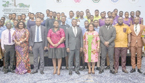 Richard Gyan-Mensah (middle), Deputy Minister of Energy and Green Transition, with Prof. John Gartchie Gatsi (3rd from left), Board Chairman of the Energy Commission; Chris Nanabanyin Yalley (3rd from right), acting Deputy Executive Secretary, Energy Commission, and officials and students after the event