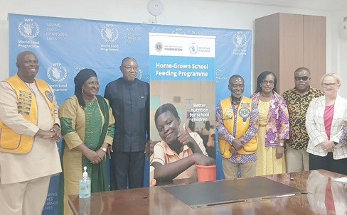 Dr Clement Apaak (3rd from left), Deputy Minister of Education; Prince Obeng Dwamena (4th from right), District Governor of Lions Club District 418; Aurore Rusiga (3rd from right), WFP Country Director and Representative in Ghana, and other officials launching the programme