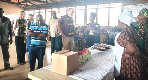 John Mikal Kvistad (middle), Norwegian Ambassador to Ghana, inspecting some of the products at the CEWEFIA Fish Processing and Training Centre at Elmina