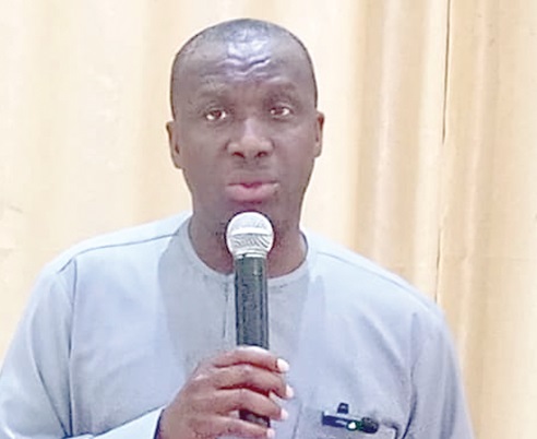 Samuel Adom Botchway (right), acting Registrar of Births and Deaths, addressing the participants 