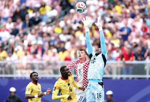 Black Stars goalkeeper, Benjamin Asare, makes an aerial save during the game