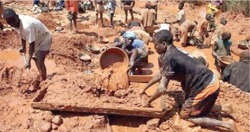 The youth prospecting for gold at a galamsey site
