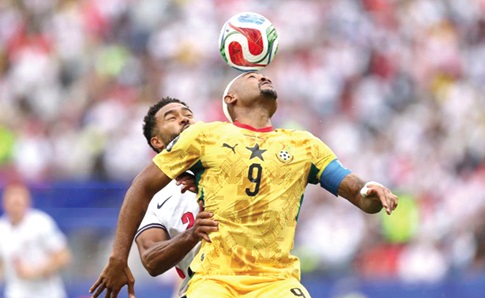 Ghana’s Jordan Ayew wins an aerial battle against Reece James of England during yesterday’s game