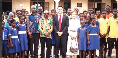 Officials of Fenice Metal Technology Limited with pupils and staff of Buerko Good Shepherd Anglican Primary School after the donation