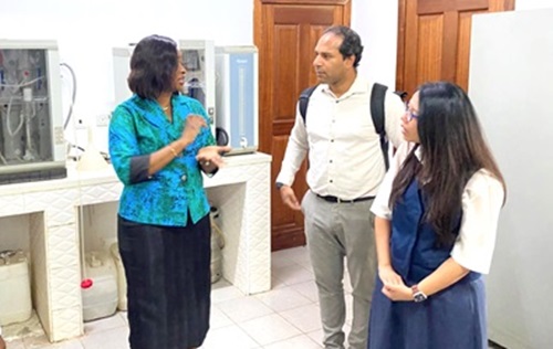 Dr­ Cynthia Laar (left) engaging the TWAS delegation during their tour of the National Isotope Hydrology Laboratory
