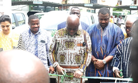 Eric Opoku (middle), Minister of Food and Agriculture, with Priya Gujadhur (left), FAO Representative in Ghana, Dr Abebe Haile-Gabriel (right), Assistant Director- General, FAO, cutting a ribbon to officially hand over the vehicles (inset) and items.  Picture: BENEDICT OBUOBI