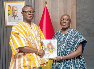 Richard Akpokavie (right), GOC President, handing over the strategy document to Kofi Iddie Adams, Minister of Sports and Recreation