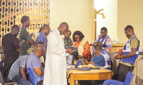 Officials of the EC collating results