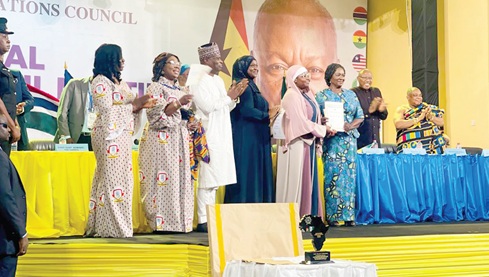 Prof. Naana Jane Opoku-Agyemang (3rd from right), the Vice President, presenting the Overall Best Prize to Suleman Huda Suglo, a former student of Legacy Girls