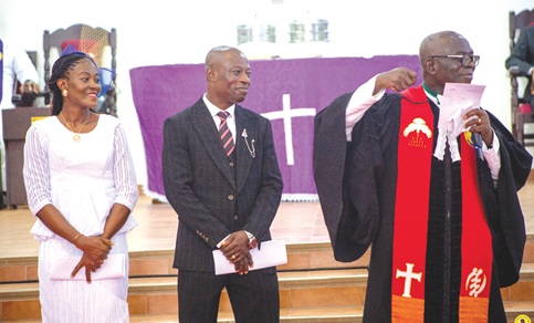 Very Rev. Samuel Kofi Kankam (right), Superintendent Minister of the church,  with Stephen Amugyah (middle), Steward Finance, and Sussana Tetteh (left), Steward Administrator, during the induction service