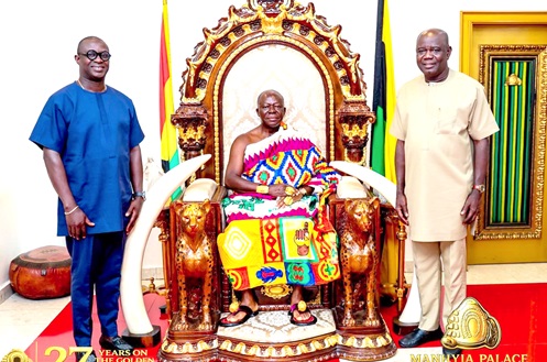Otumfuo Osei Tutu II (middle), Asantehene, with Paul Adjei (right), GETFund Administrator