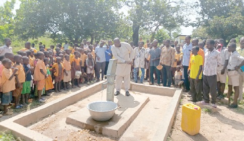 Dordoe Kudjoe Isaiah, Nkwanta North DCE, commissioning a hand pump at Kpassa D/A Basic School Dordoe Kudjoe Isaiah, Nkwanta North DCE, commissioning a hand pump at Kpassa D/A Basic School