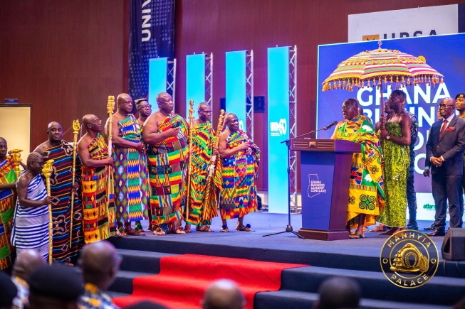 Otumfuo Osei Tutu II (seated), Asantehene, exchanging pleasantries with Prof. Joshua Alabi (left), Board Chair, GCB Bank PLC. Looking on are Prof. John K. M. Mawutor (3rd from right), Vice-Chancellor, UPSA, and other officials of the university. Picture: ERNEST KODZI