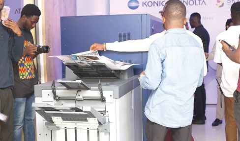 Some participants in the launch examining materials printed by the machine. Some participants in the launch examining materials printed by the machine.