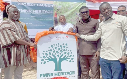  Naab Serig Sore Sobil IV (left), the chief of Pelungu, being supported by Joshua Baidoo (right), Strategy and Integrated Programme Director at World  Vision Ghana, and Francis Yenwona Tobig, Nabdam DCE, to unveil the project at the launch, while others look on