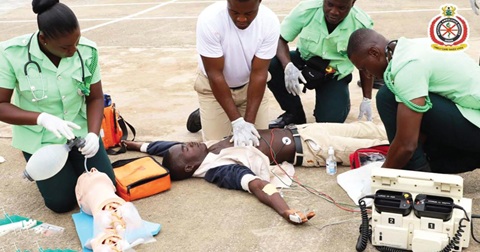 Personnel from the National Ambulance Service demonstrating how to resuscitate a patient