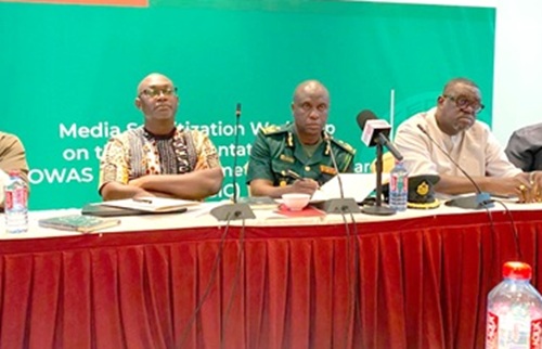 DCOI Justice Amevor (middle), Head of Operations at the Ghana Immigration Service, with Albert Siaw-Boateng (left), Director of ECOWAS Free Movement of Persons, Migration and Tourism, with other dignitaries at the media sensitisation