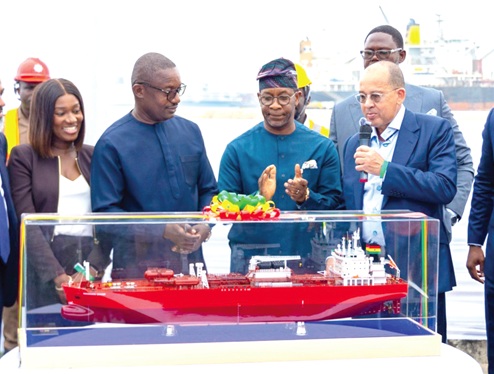 Adedeji Odunsi (right), Executive Director of Sahara Group, showing  Dr John Abdulai Jinapor  (2nd from left), the Minister of Energy and Green Transition, a miniature vessel. With them include, Yaa Serwaa Alifo (left), Managing Director of Asharami Ghana