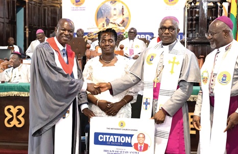 Most Rev. Professor Johnson K. Asamoah-Gyadu (2nd from right), Presiding Bishop, Methodist Church Ghana, presenting a citation to Kwasi Attah-Antwi (left), outgoing Lay President, and his wife, during the event while Rt Rev. William Agyei Mpere-Gyekye (right), Administrative Bishop, looks on