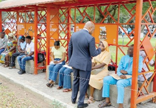 Samuel Okudzeto Ablakwa (right), Minister of Foreign Affairs, interacting with some visa applicants  at the application centre. Picture: ELVIS NII NOI DOWUONA