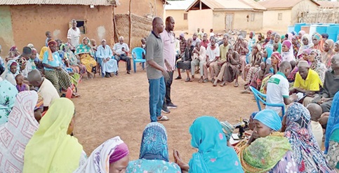 Officials of the Ghana Agriculture Insurance Pool  engaging farmers on climate-resilient issues