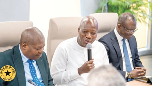 Mahama Ayariga (middle), Minister of Local Government, Chieftaincy and Religious Affairs, speaking at the Heads of Banks Meeting. With him are Dr Zakari Mumuni (right), First Deputy Governor, Bank of Ghana, and Prof John Gartchie Gatsi (left), a Director, BoG