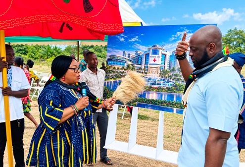  Rev. Dr. Pam Fomunung (in smock), Chief Executive Officer and Group Chair of Africa’s Brain Bank Global, and  Dr. Michael Kwame Obeng, a renowned Ghanaian Plastic Surgeon and Board President for the organisation, explaining the concept of the design for the proposed medical city