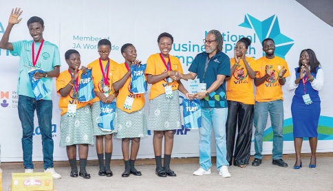 Contestants of Adonten SHS receiving their award from Edem Amedi-Addie  (4th from right),  Executive Director of JA Ghana