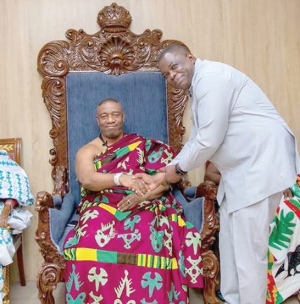 King Tackie Teiko Tsuru II ( seated), Ga Mantse,  welcoming Governs Agbodza, Minister of Roads and Highways, to his palace 