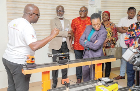 Dr Zanetor Agyeman-Rawlings (4th from right), Minister of Environment, Science and Technology, inspecting an equipment at the Ghana Atomic Energy Commission. With her are Prof. Samuel Boakye Dampare (2nd from left), Director-General, Ghana Atomic Energy Commission, and Dr Eric Glover (left), Director of the Radiation Protection Institute. Picture: ELVIS NII NOI DOWUONA 