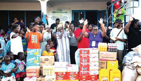 Flashback: Members of OneWay Missions Global interacting with some children after presenting them with food items during an outreach