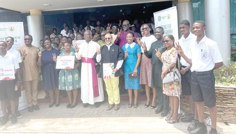 Zia Chodhury (4th from right), UN Resident Coordinator, and the Most Reverend Emmanuel Kofi Fianu (5th from left), Governing Board Chairman, NPC, with students of Accra High and Accra Girls senior high schools