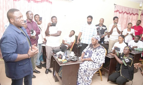 Samuel Nartey George (left), Minister of Communications,  Digital Technology and Innovations, addressing some of the coders  undergoing training at the Kwadaso Regional Information Centre