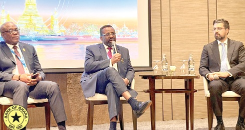 Dr Johnson Pandit Asiama (middle), Governor, BoG, speaking at the event