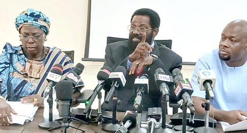 Alfred Okoe Vanderpuije (middle), Chairman of Parliament’s Committee on Foreign Affairs, addressing the press