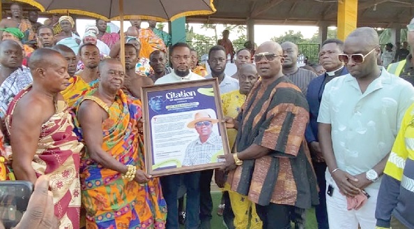 Nana Amponsem Darko II (2nd from left), Chief of Atronie, presenting the citation to Alex Boampong, Chief Executive Officer (CEO) of Alexiboam Company Ltd