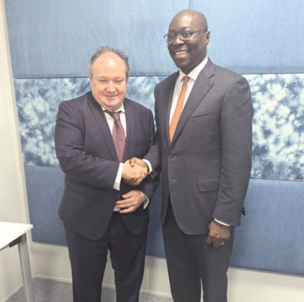 Dr Cassiel Ato Forson (right), Minister of Finance, in a handshake with Ambroise Fayolle, Vice-President, EIB