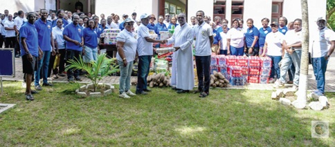  Francis K Oppong, President of the Holy Family Akankuo of the parish,  presenting the items to Very Rev. Francis Arthur, former Rector of St. Paul's Seminary.
