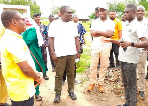 Peter Dongi (right), Banda District Chief Executive, explaining things to Ahmed Ibrahim (2nd from right), Member of Parliament for Banda, and Joseph Addae Akwaboa (2nd from left), Bono Regional Minister, during the inspection