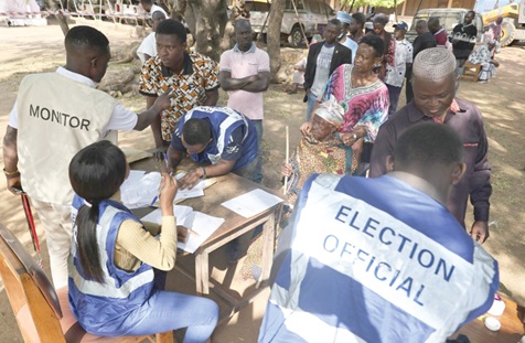 Some electorates being verified at a polling station