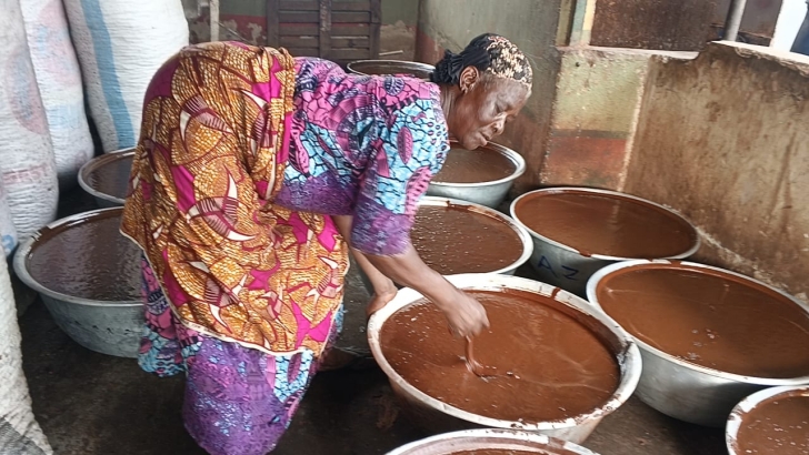 A shea butter processor at work A shea butter processor at work